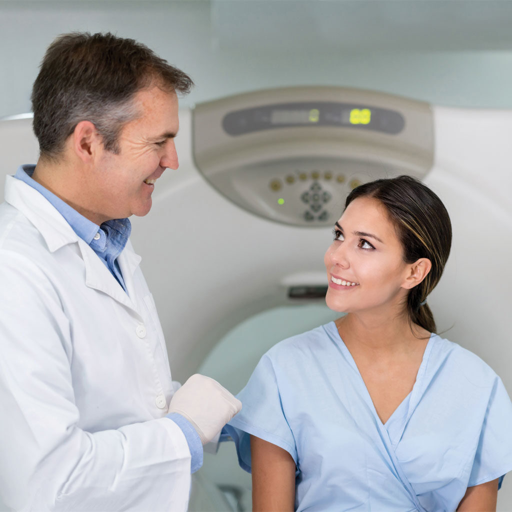 Doctor with patient and MRI machine