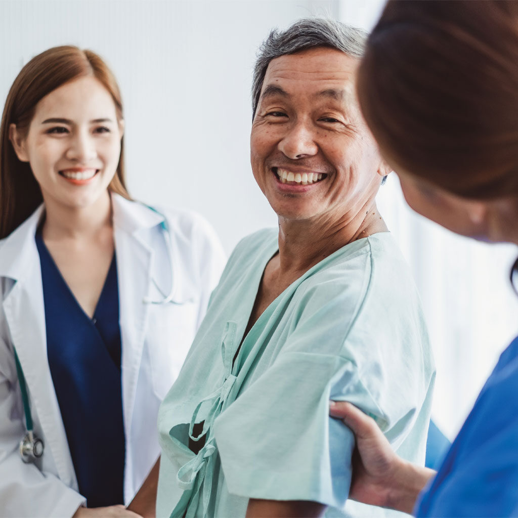 Doctors with patient for PET/CT scan