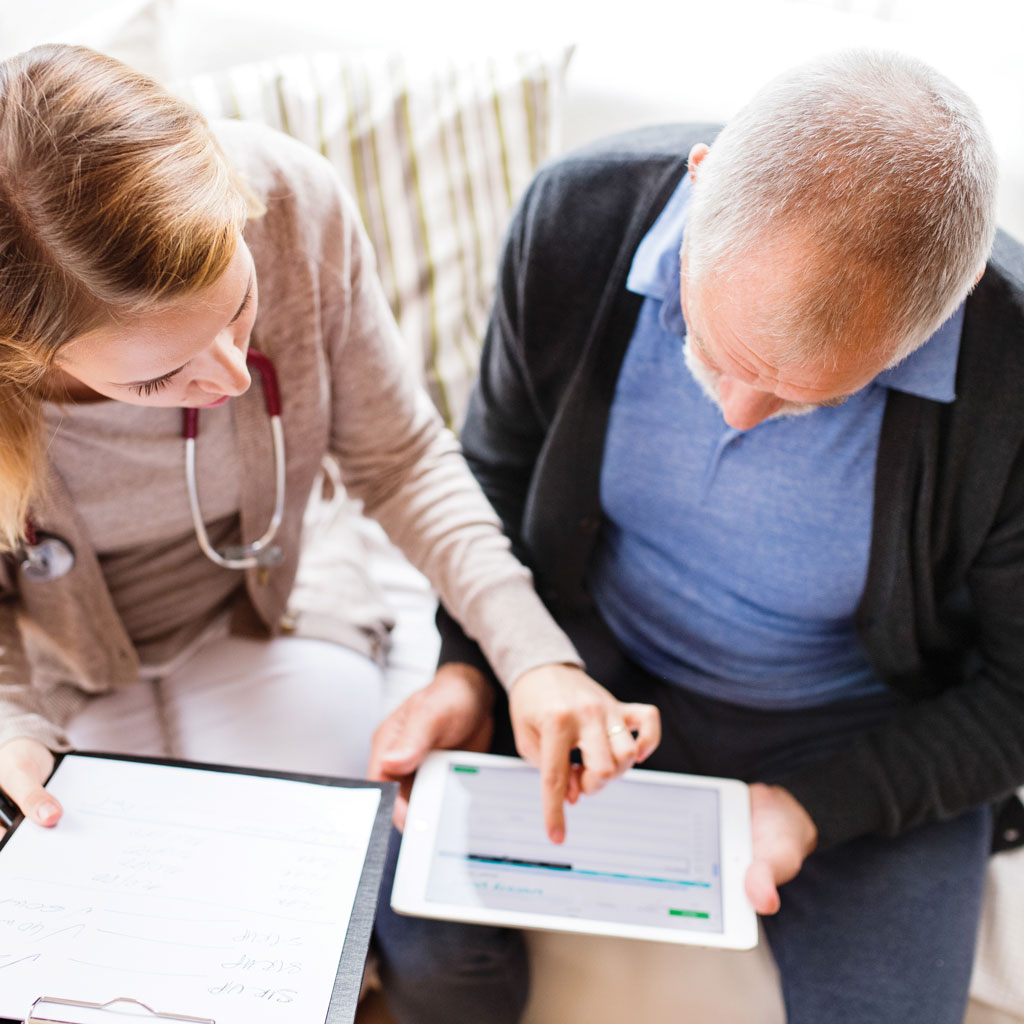 Man with Doctor Reviewing His Screening for an Abdominal Aortic Aneurysm